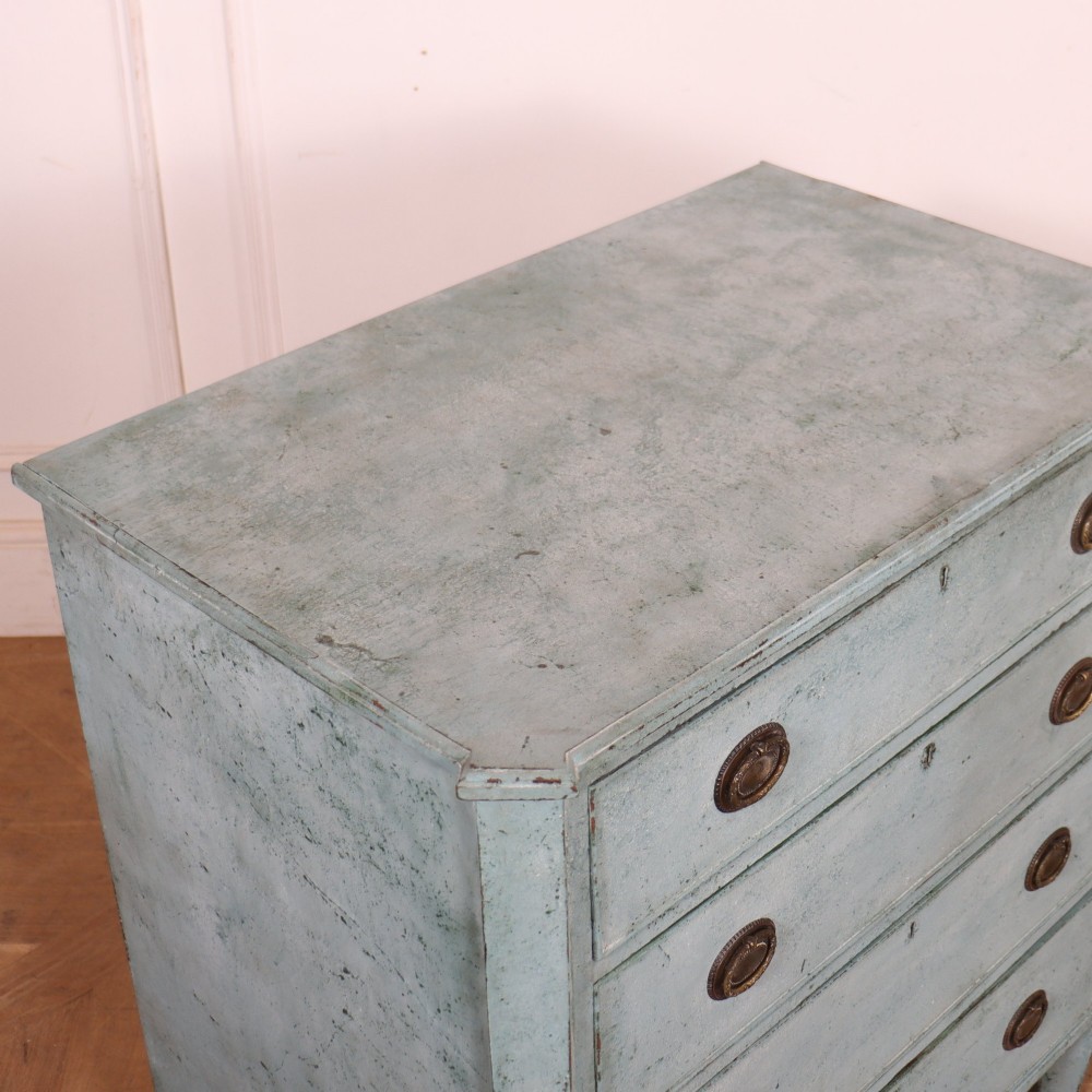 A pale blue painted Swedish commode with four drawers, oval brass pull handles, and square tapered feet. View VIII