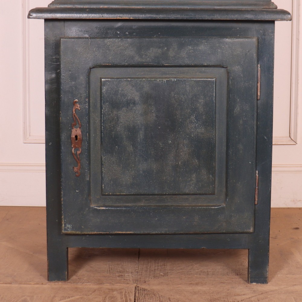 A tall, narrow antique French provincial food cupboard in a dark grey painted finish, featuring recessed upper panels, a central drawer, and a lower single-door cabinet. View IV