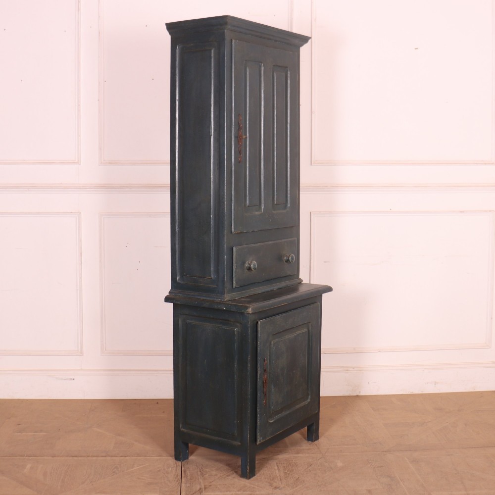 A tall, narrow antique French provincial food cupboard in a dark grey painted finish, featuring recessed upper panels, a central drawer, and a lower single-door cabinet. View VIII