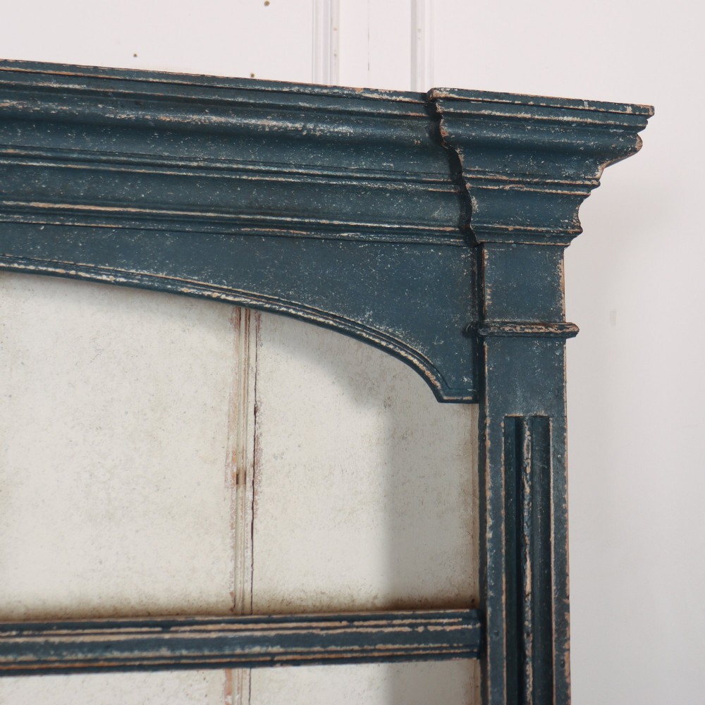 A large dark blue painted antique West Country dresser featuring an open plate rack with off-white backboards above three drawers and three panelled cupboard doors. View III