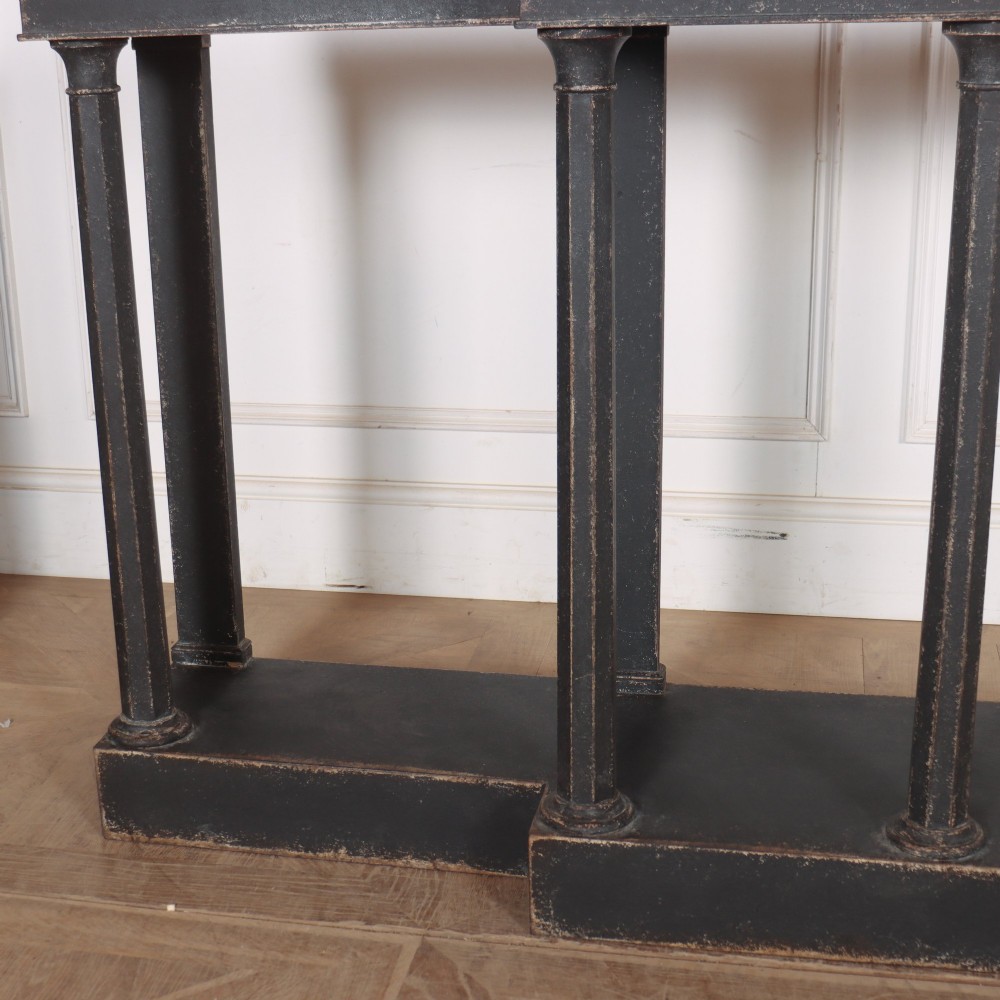 A long black painted beech console table featuring turned column legs and a solid plinth base. View IV