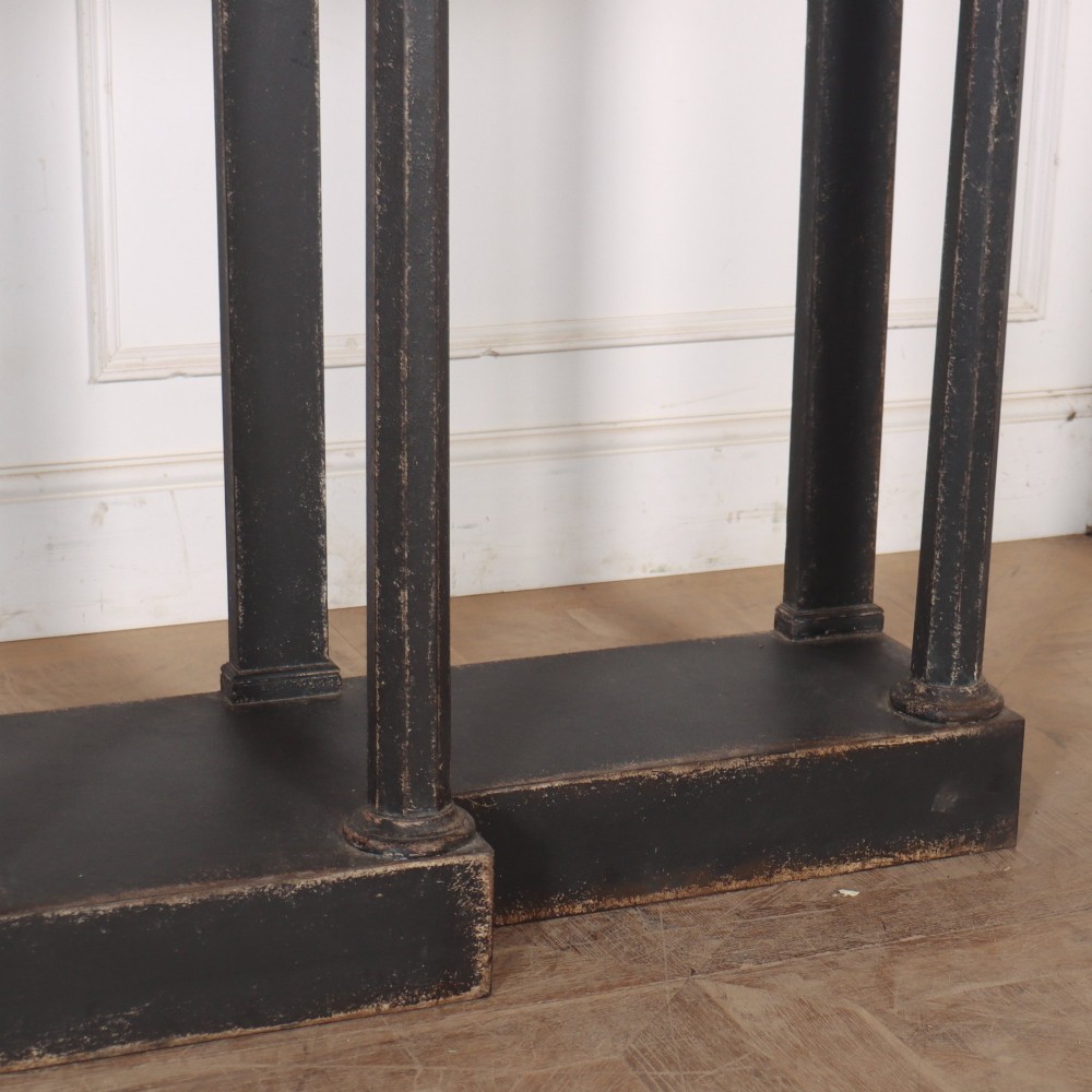 A long black painted beech console table featuring turned column legs and a solid plinth base. View VI