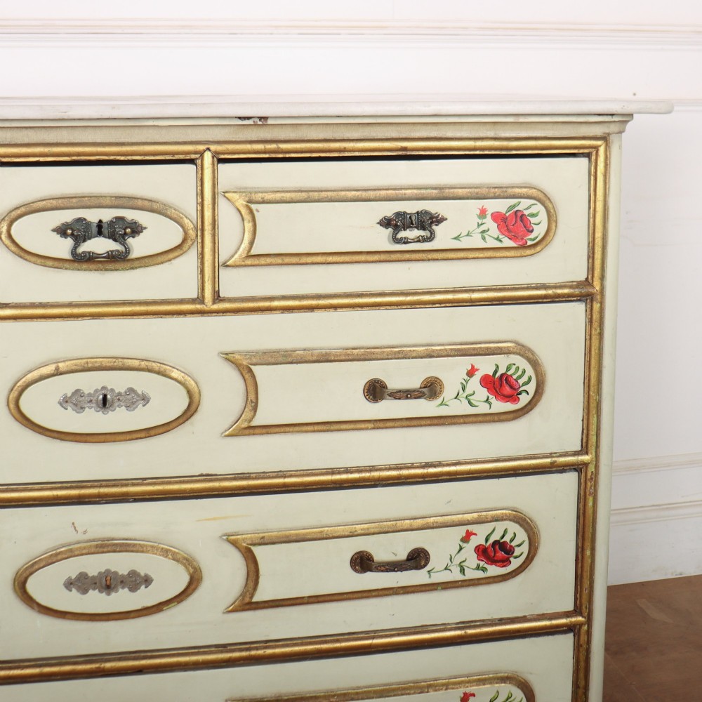 A 19th-century Spanish painted commode in cream featuring hand-painted red floral accents, gilded drawer mouldings, and brass handles. View III