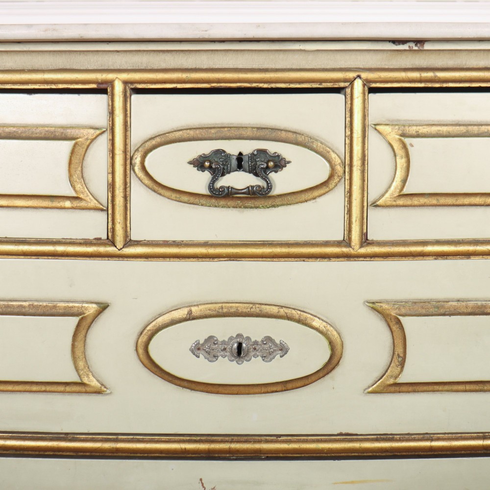 A 19th-century Spanish painted commode in cream featuring hand-painted red floral accents, gilded drawer mouldings, and brass handles. View VI