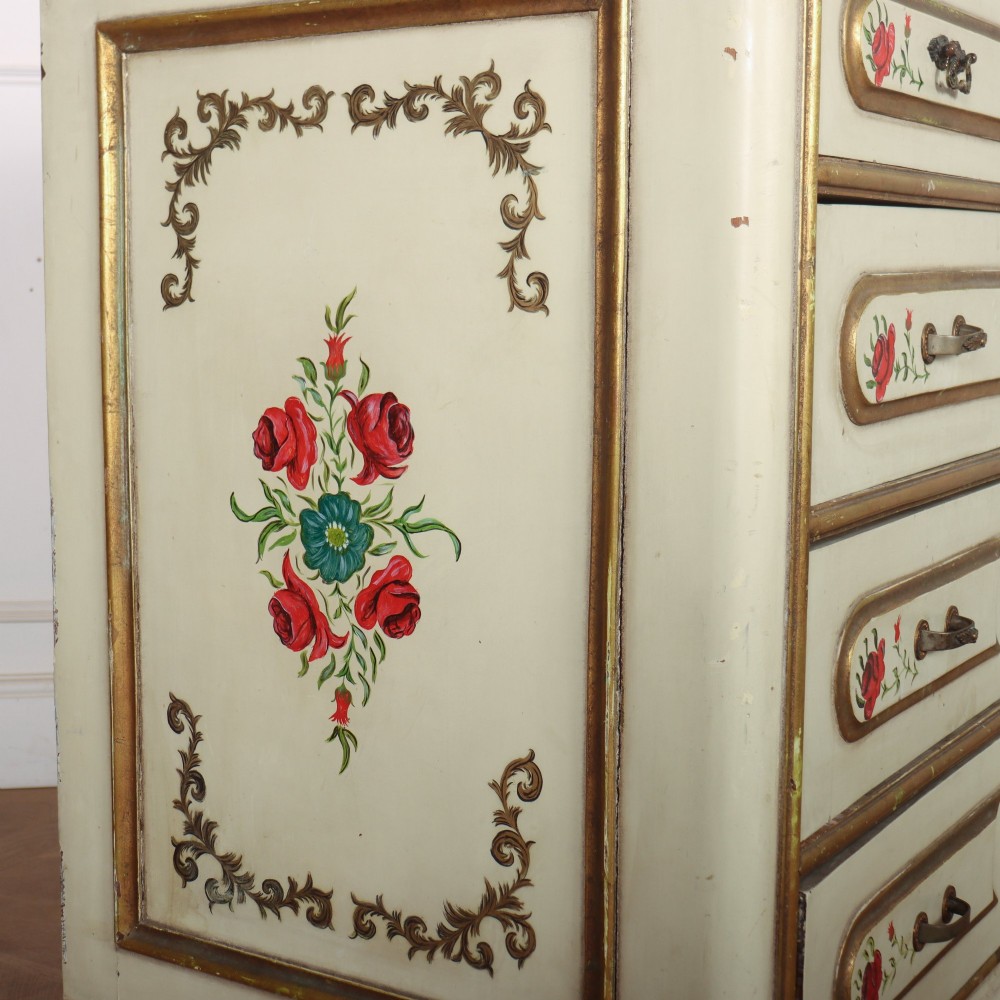 A 19th-century Spanish painted commode in cream featuring hand-painted red floral accents, gilded drawer mouldings, and brass handles. View VIII
