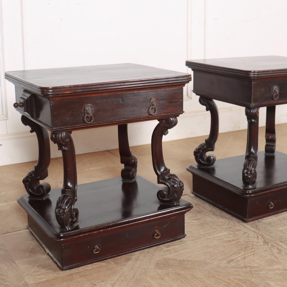 A pair of dark mahogany Irish bedside tables featuring upper drawers, carved scroll legs, open lower shelves, and plinth bases. View II