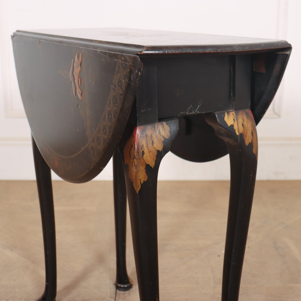 A small black lacquered drop-leaf side table featuring hand-painted gold Chinoiserie decoration and cabriole legs. View II