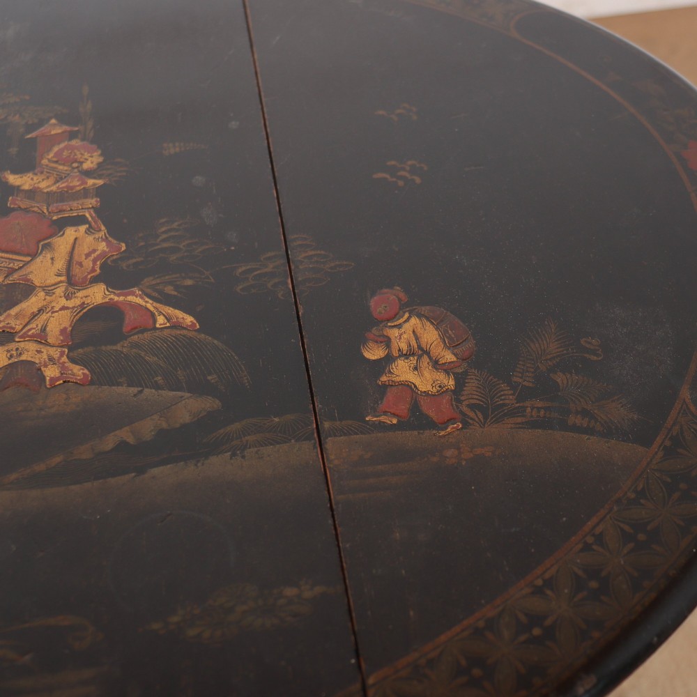 A small black lacquered drop-leaf side table featuring hand-painted gold Chinoiserie decoration and cabriole legs. View VII