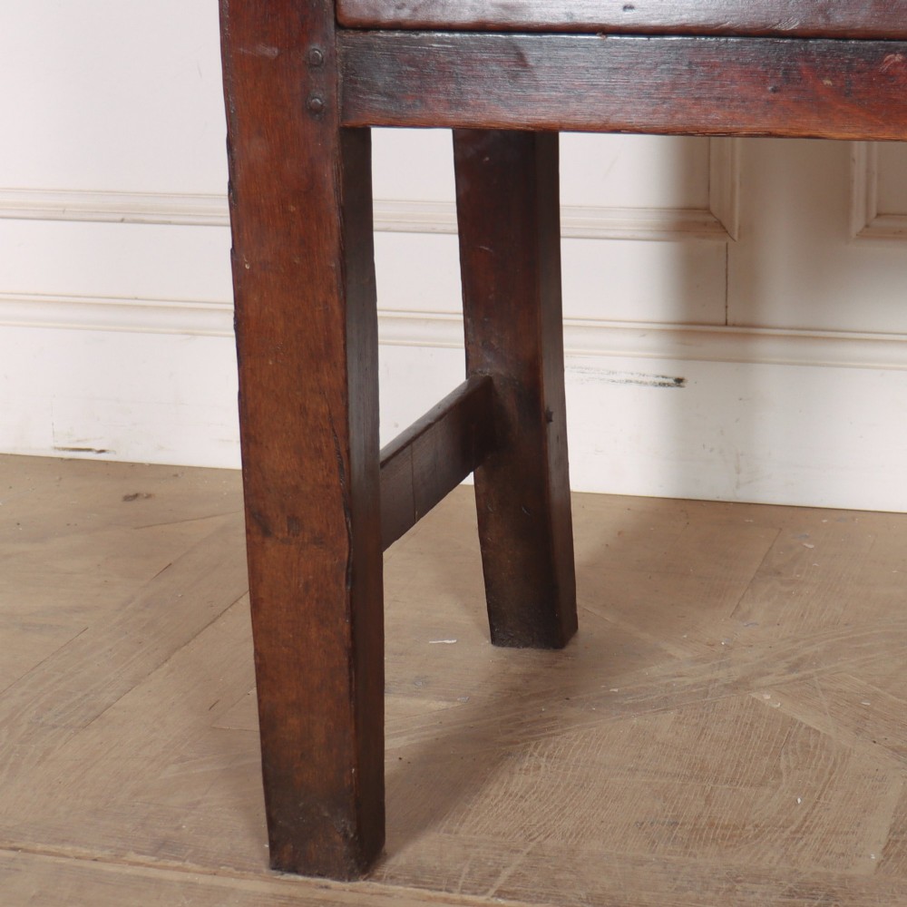 A long dark brown oak dresser base featuring two deep frieze drawers, circular metal knobs, and square legs joined by side stretchers. View III