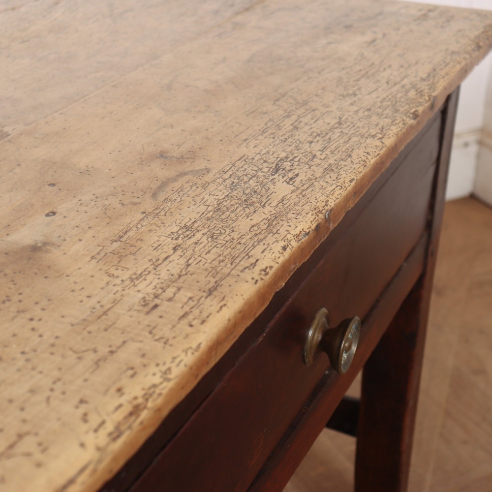 A long dark brown oak dresser base featuring two deep frieze drawers, circular metal knobs, and square legs joined by side stretchers. View IX