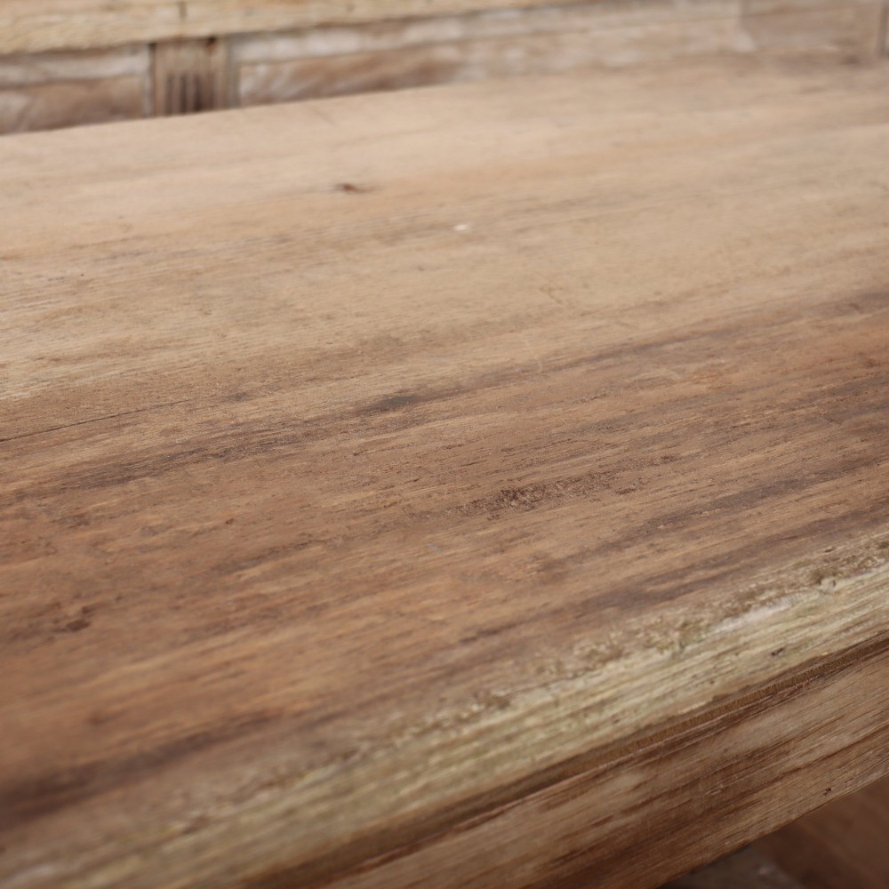 A pair of long rustic wooden French console tables with lower open shelves and weathered pale timber finish. View VIII