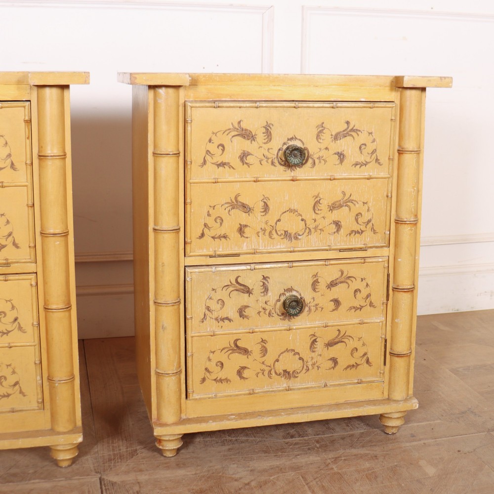 A pair of 19th-century pale yellow painted bedside cabinets featuring turned faux bamboo corner columns and hand-painted foliate motifs. View III