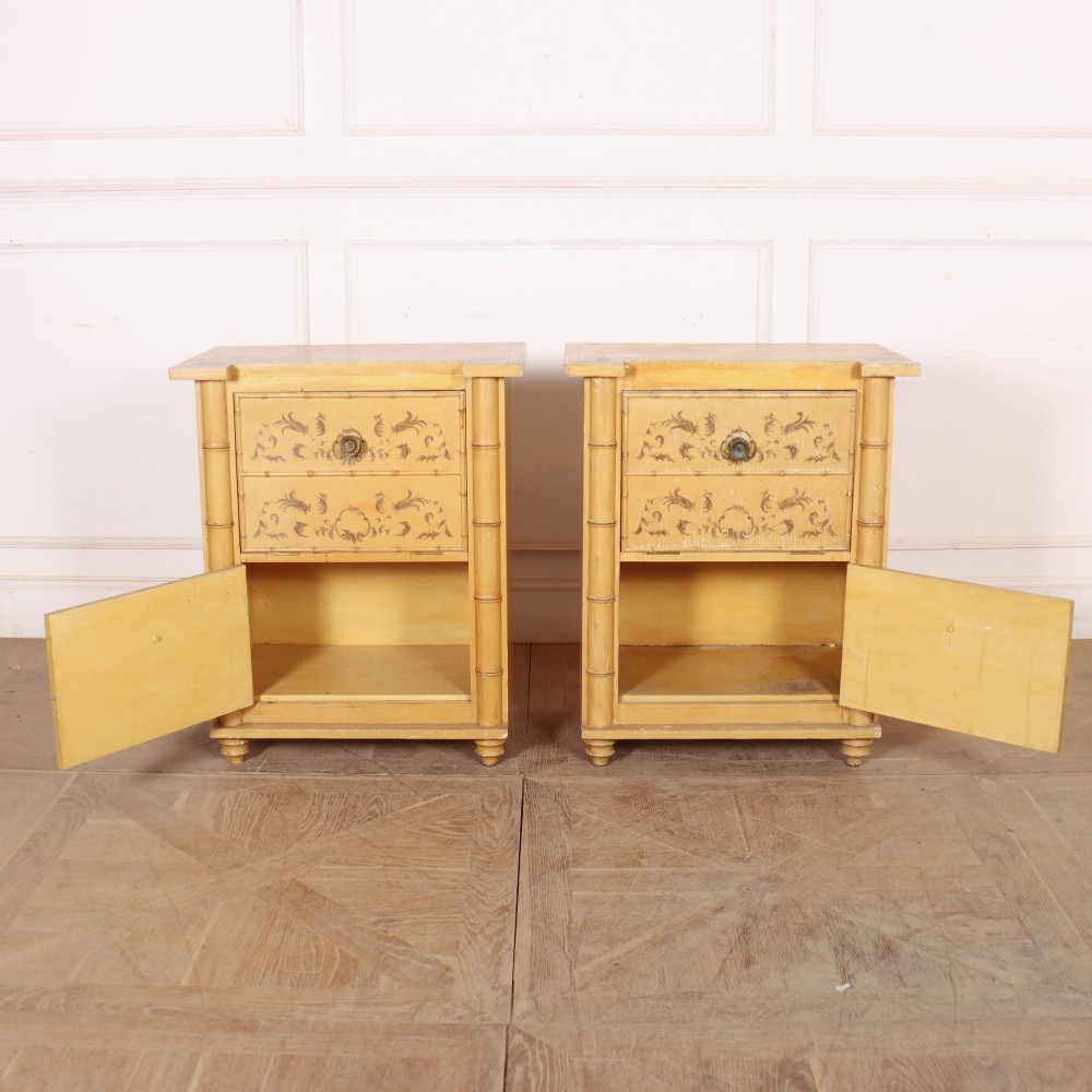 A pair of 19th-century pale yellow painted bedside cabinets featuring turned faux bamboo corner columns and hand-painted foliate motifs. View VIII