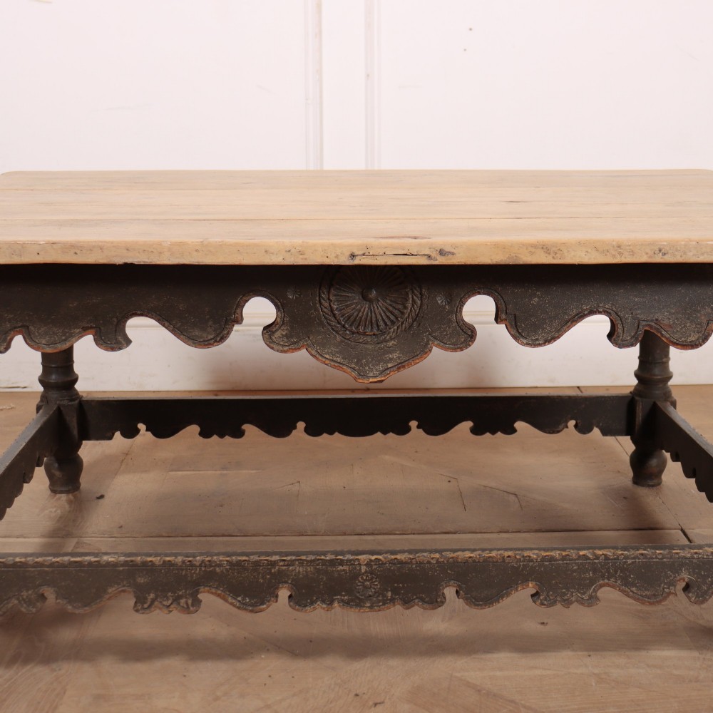 A low rectangular coffee table with a scrubbed pine top and dark painted frame featuring scalloped aprons, a carved shell motif, and turned legs. View IV