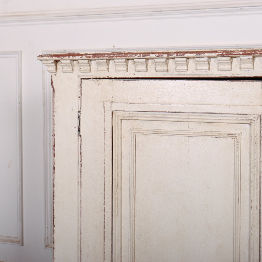 A long four-door Italian painted wooden enfilade with a distressed off-white finish, moulded cupboard panels, and bracket feet. View II