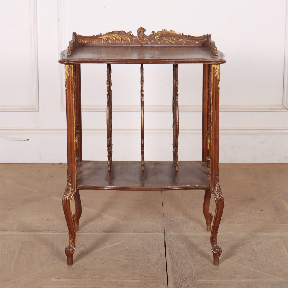An antique French Rococo style wooden folio stand featuring carved openwork dividers, turned side spindles, cabriole legs, and parcel gilt detailing. View II