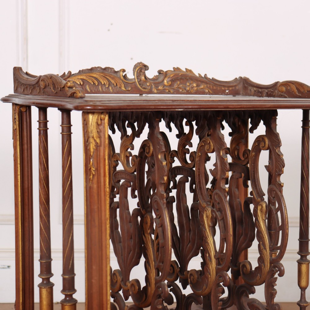 An antique French Rococo style wooden folio stand featuring carved openwork dividers, turned side spindles, cabriole legs, and parcel gilt detailing. View III