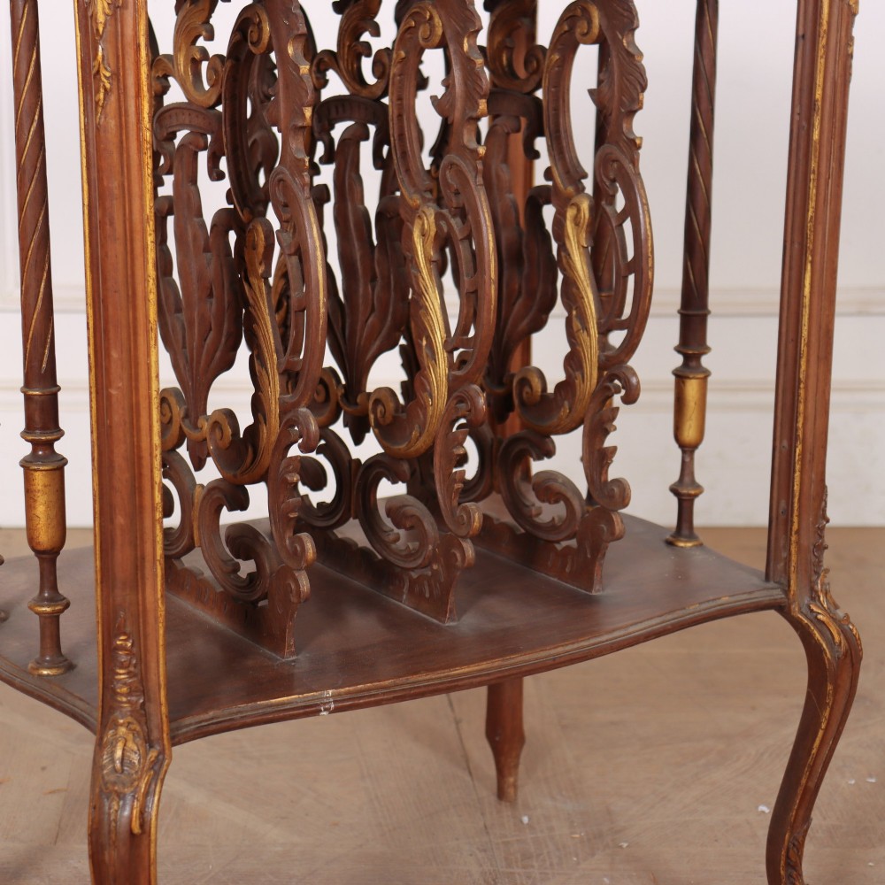 An antique French Rococo style wooden folio stand featuring carved openwork dividers, turned side spindles, cabriole legs, and parcel gilt detailing. View IV