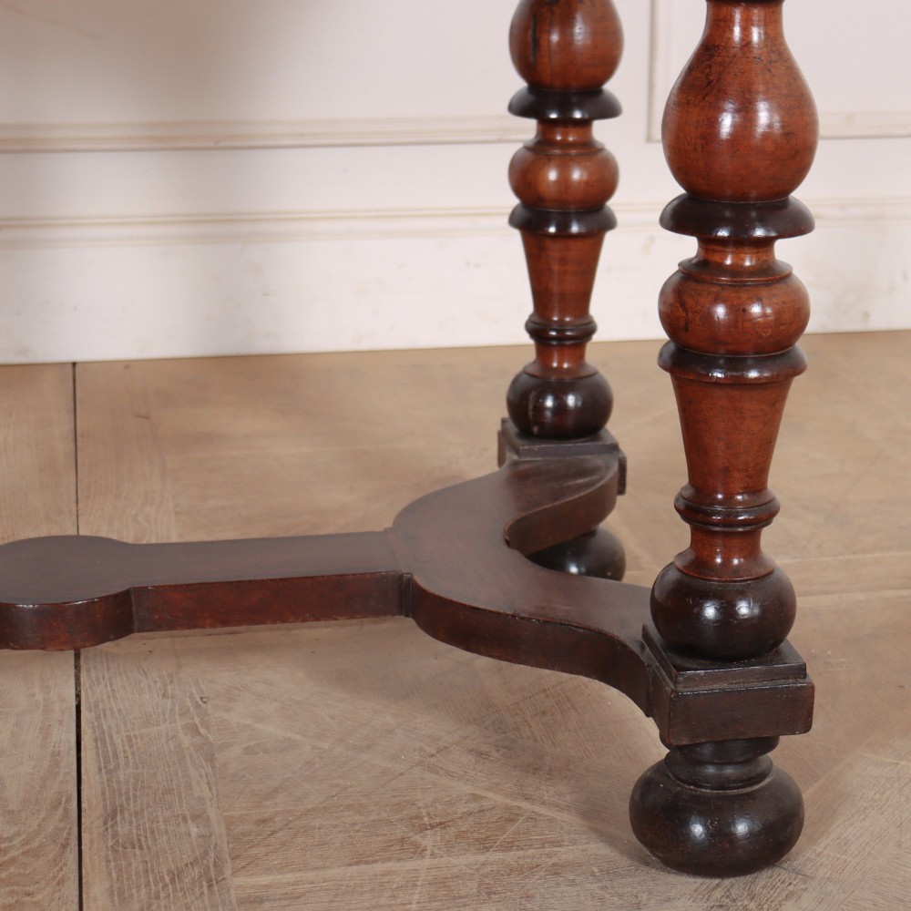 A warm brown wooden Italian side table desk featuring a single drawer with a round knob, heavy turned legs, and a shaped stretcher base. View IV