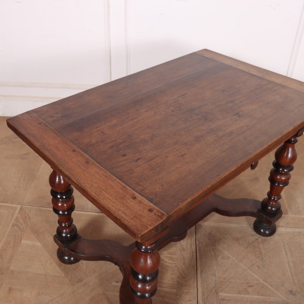 A warm brown wooden Italian side table desk featuring a single drawer with a round knob, heavy turned legs, and a shaped stretcher base. View VIII