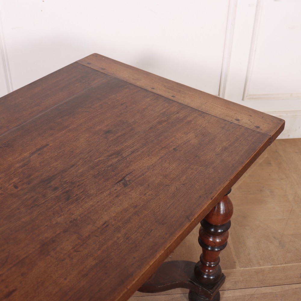 A warm brown wooden Italian side table desk featuring a single drawer with a round knob, heavy turned legs, and a shaped stretcher base. View IX