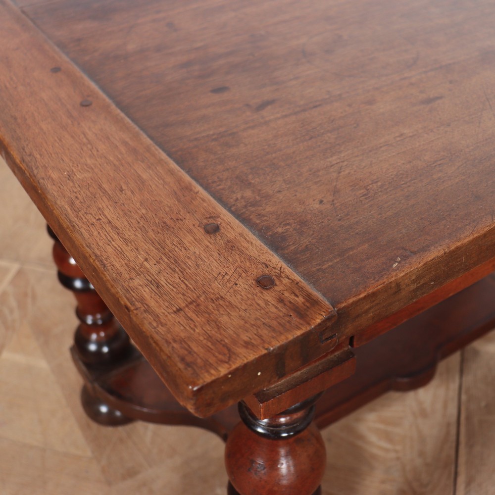 A warm brown wooden Italian side table desk featuring a single drawer with a round knob, heavy turned legs, and a shaped stretcher base. View X
