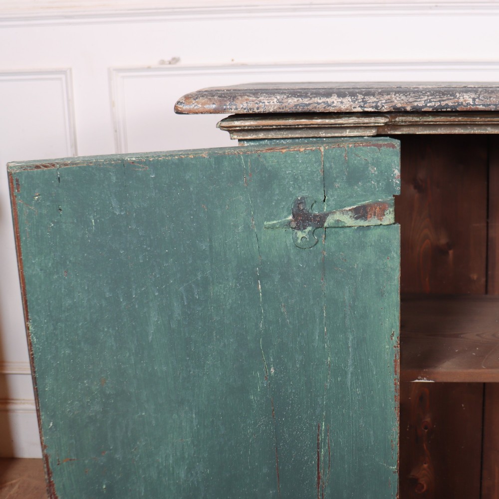A long rectangular antique Italian side cabinet featuring four panelled doors in a distressed sage and teal painted finish with a plinth base. View IX