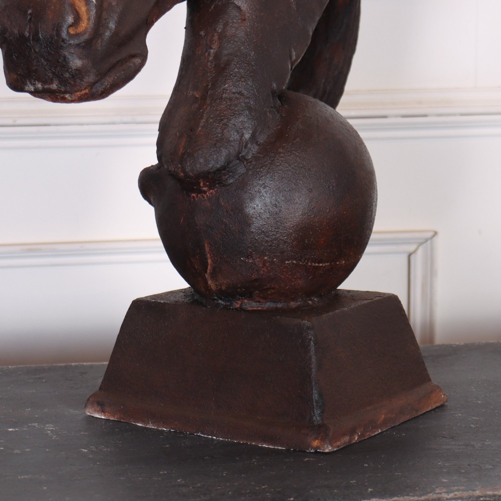 A pair of dark brown cast iron horse head sculptures mounted on spherical supports with square plinth bases. View VI