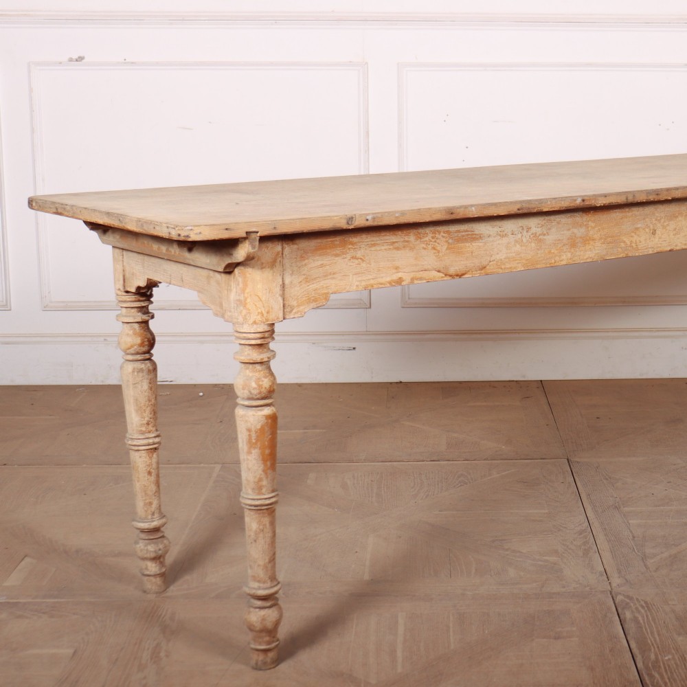 A long antique Italian painted wood farm table with turned legs and a distressed cream finish. View II