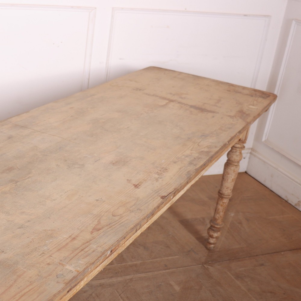 A long antique Italian painted wood farm table with turned legs and a distressed cream finish. View IV