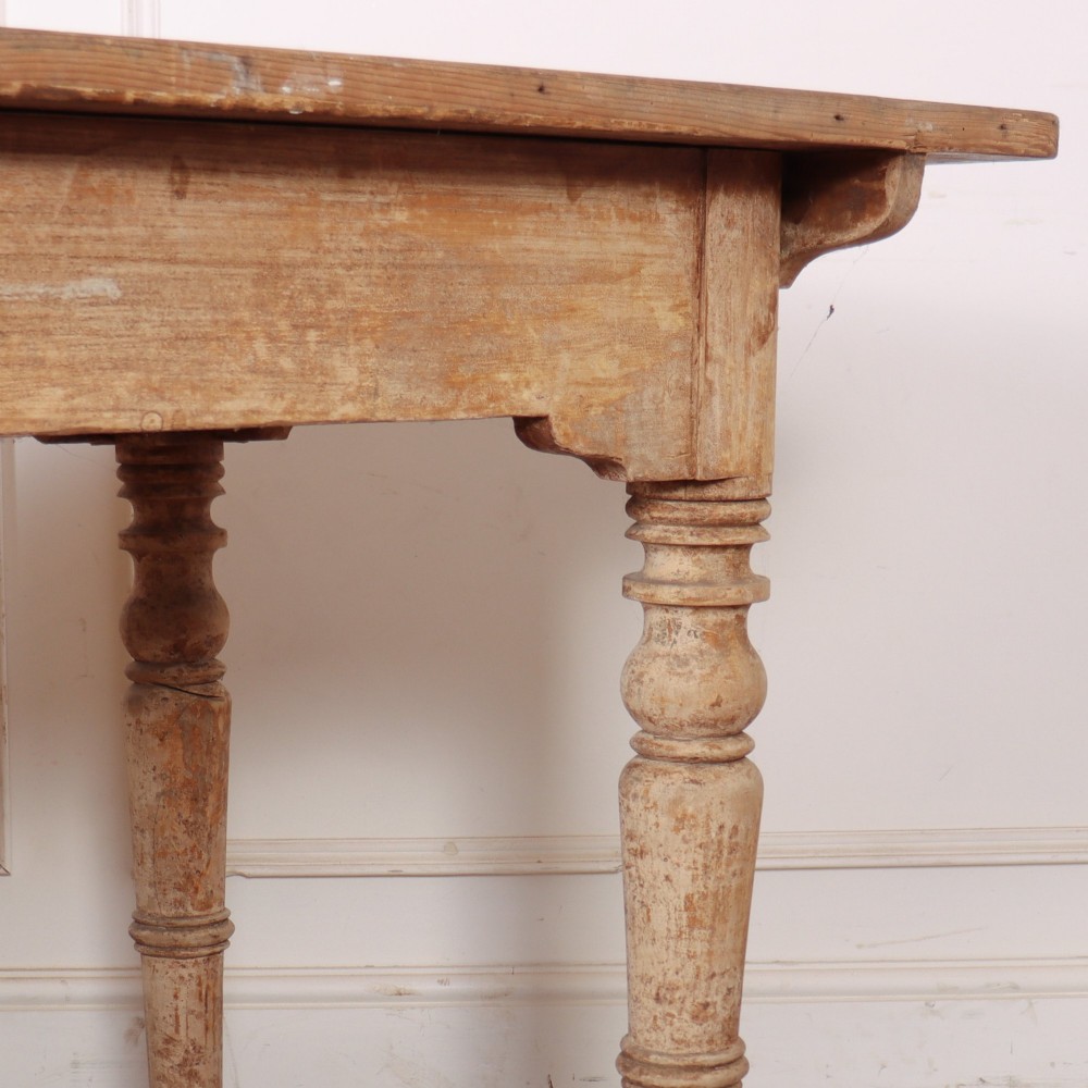 A long antique Italian painted wood farm table with turned legs and a distressed cream finish. View VII