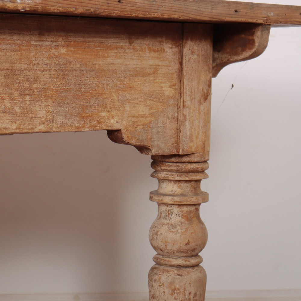 A long antique Italian painted wood farm table with turned legs and a distressed cream finish. View VIII