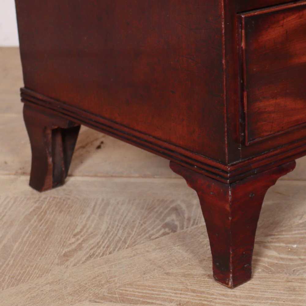 A matching pair of dark mahogany bedside chests, each featuring four drawers with turned wooden knobs and bracket feet. View VIII