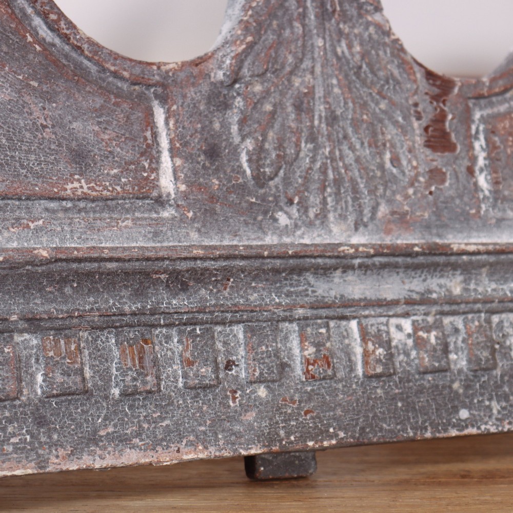 A 19th-century grey metal broken pediment overdoor fragment with classical moulding and a central urn pedestal motif. View VI