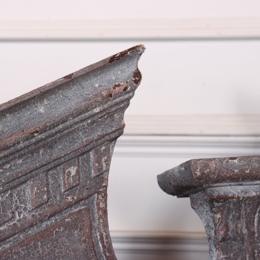 A 19th-century grey metal broken pediment overdoor fragment with classical moulding and a central urn pedestal motif. View VII