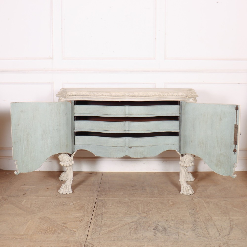 An off-white painted Italian Rococo side cabinet featuring carved acanthus leaf shoulders, a serpentine lower apron, double doors with painted blue trim, and prominent carved claw feet. View VIII