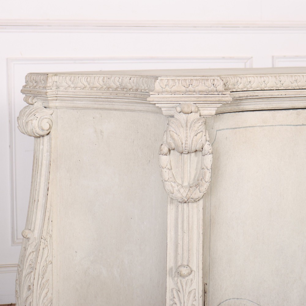 An off-white painted Italian Rococo side cabinet featuring carved acanthus leaf shoulders, a serpentine lower apron, double doors with painted blue trim, and prominent carved claw feet. View XI