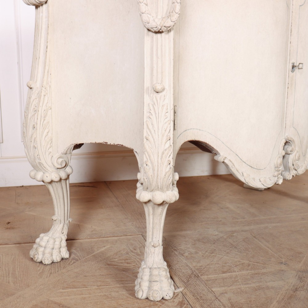 An off-white painted Italian Rococo side cabinet featuring carved acanthus leaf shoulders, a serpentine lower apron, double doors with painted blue trim, and prominent carved claw feet. View XII