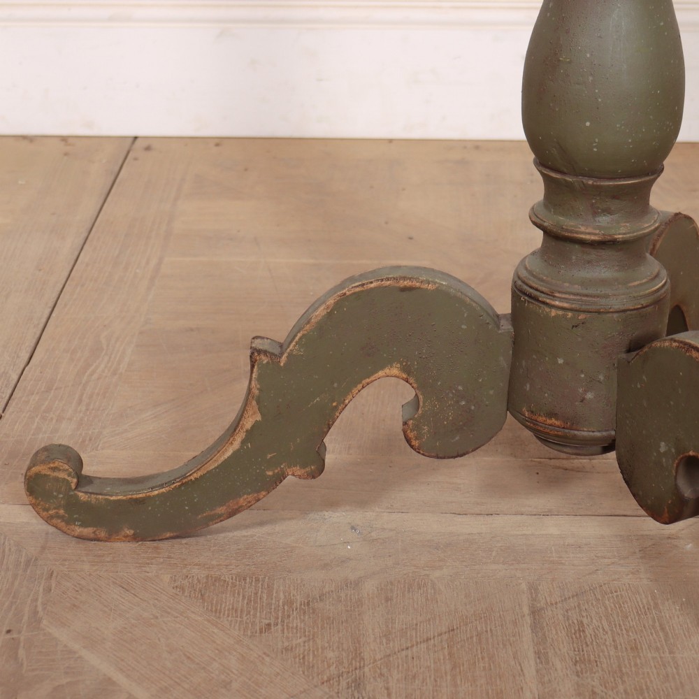 An antique Swedish painted wooden side table featuring a circular top, turned central pedestal, and scrolled tripod legs in a muted green finish. View VI