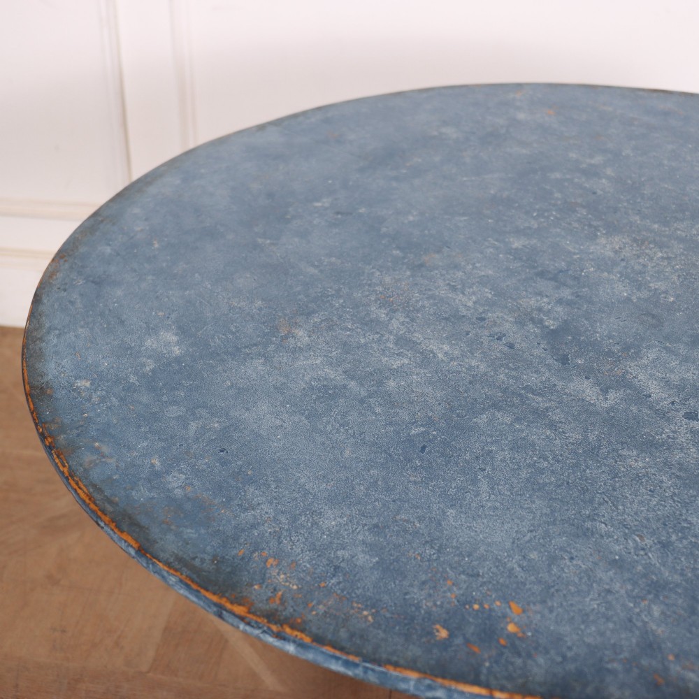 A Swedish blue painted occasional table featuring an oval top, turned central pedestal column, and carved tripod scroll legs. View V