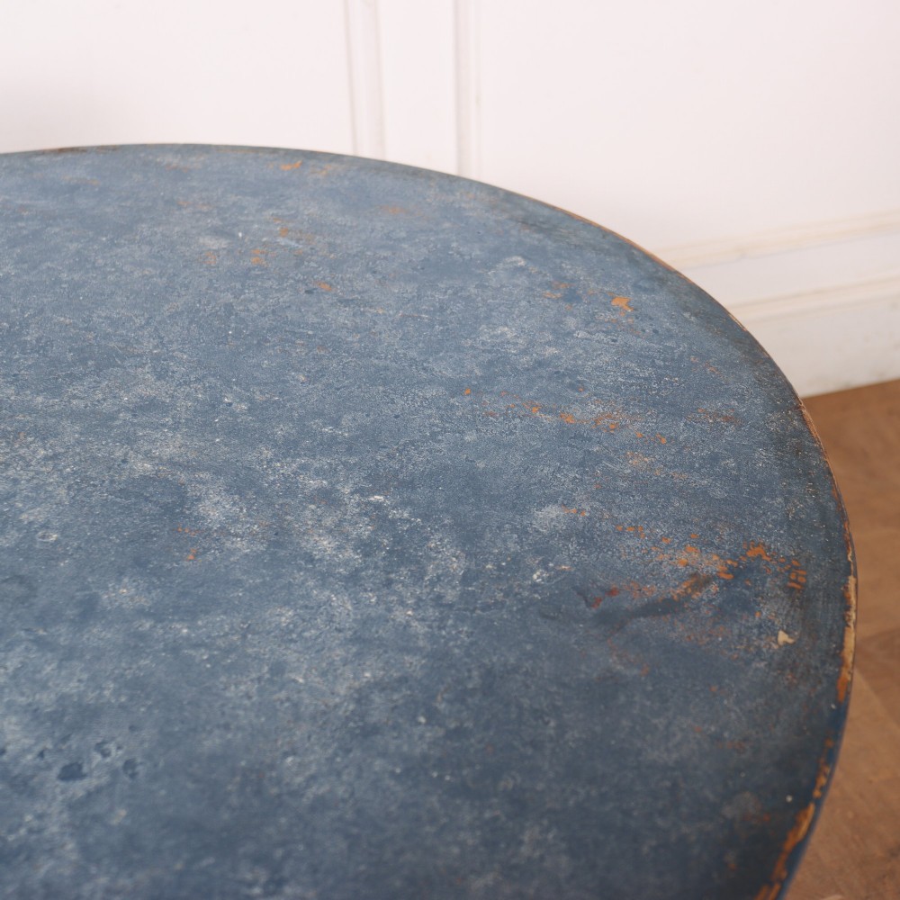 A Swedish blue painted occasional table featuring an oval top, turned central pedestal column, and carved tripod scroll legs. View VI