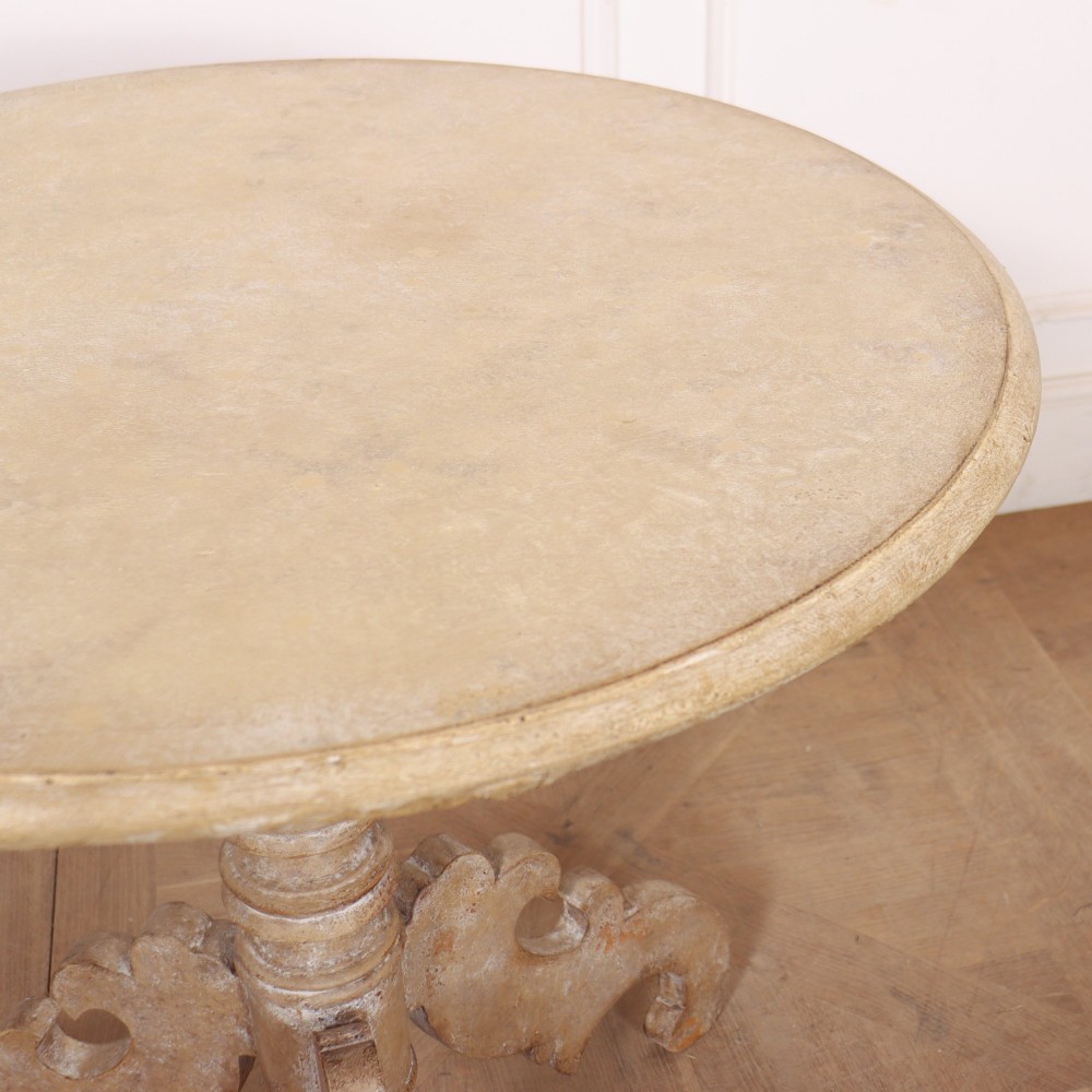 A circular painted Swedish side table featuring a turned central pedestal column resting on three carved scroll tripod legs with a distressed grey paint finish. View VII