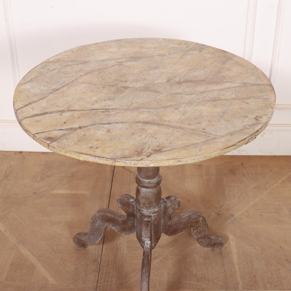 An antique Swedish painted lamp table featuring a circular top supported by a turned central column and three carved scrolled legs. View IV