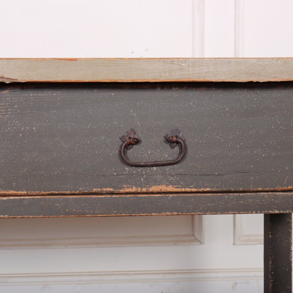 An antique English painted server table featuring a grey painted top over two dark grey drawers with metal drop handles and a low stretcher base. View VI
