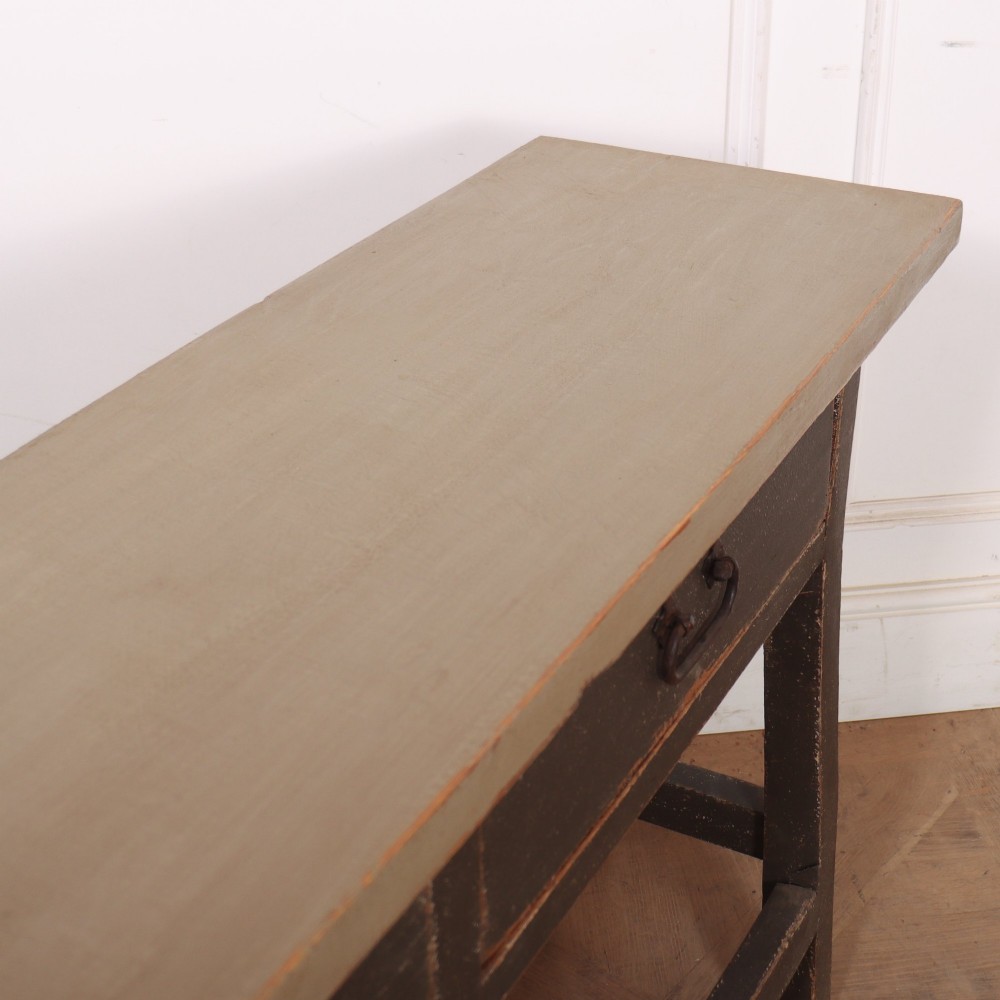 An antique English painted server table featuring a grey painted top over two dark grey drawers with metal drop handles and a low stretcher base. View IX