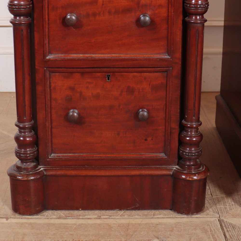 A matching pair of tall mahogany bedside chests featuring four drawers each, turned twist column pilasters, and round wooden handles. View III