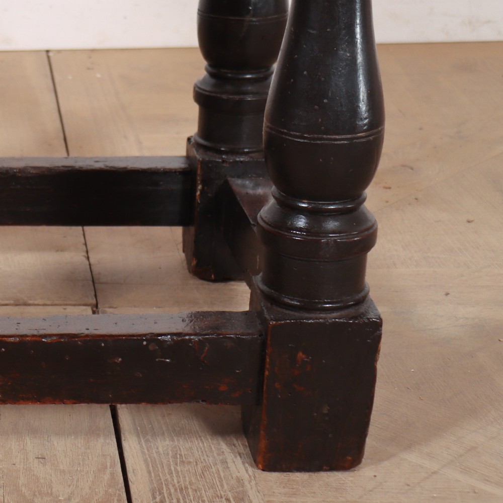 A dark brown Italian walnut side table featuring turned legs, a single frieze drawer, brass stud embellishments, and a low box stretcher. View V
