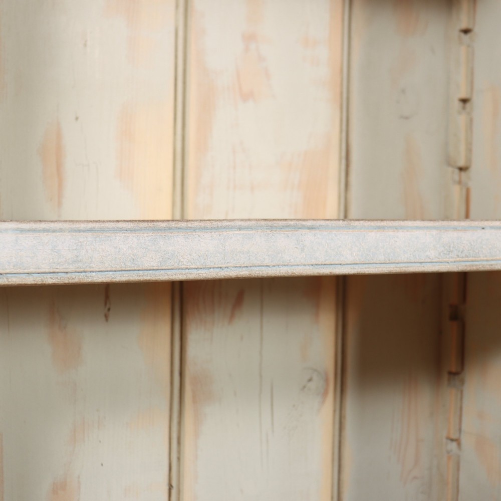 A tall, narrow French painted wooden open bookcase featuring a scalloped frieze, moulded cornice, and planked back. View VII