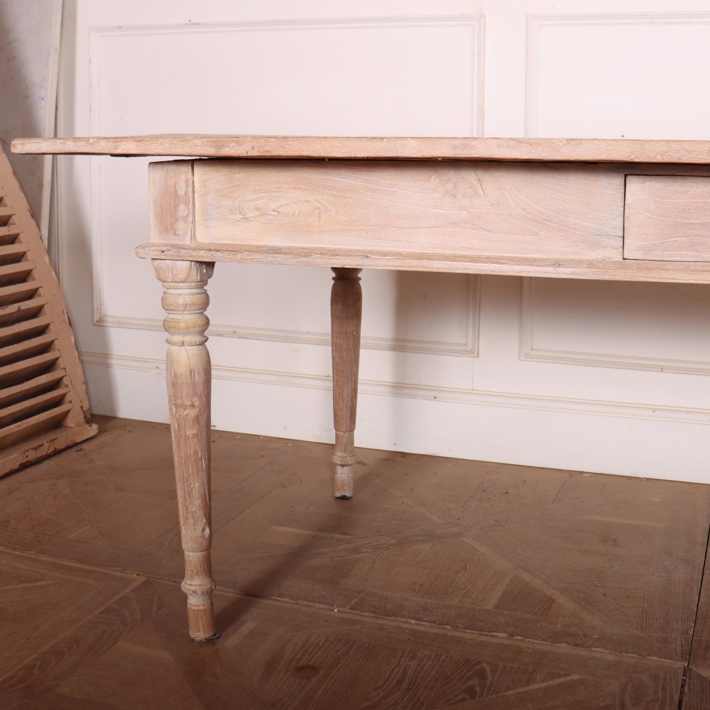 A 19th-century Spanish rustic elm dining table featuring a pale natural finish, four turned legs, and a single frieze drawer with a metal ring pull. View III