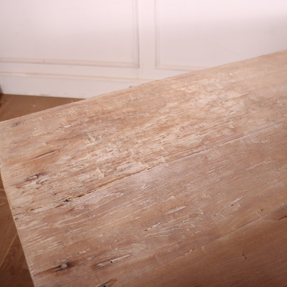 A 19th-century Spanish rustic elm dining table featuring a pale natural finish, four turned legs, and a single frieze drawer with a metal ring pull. View VIII